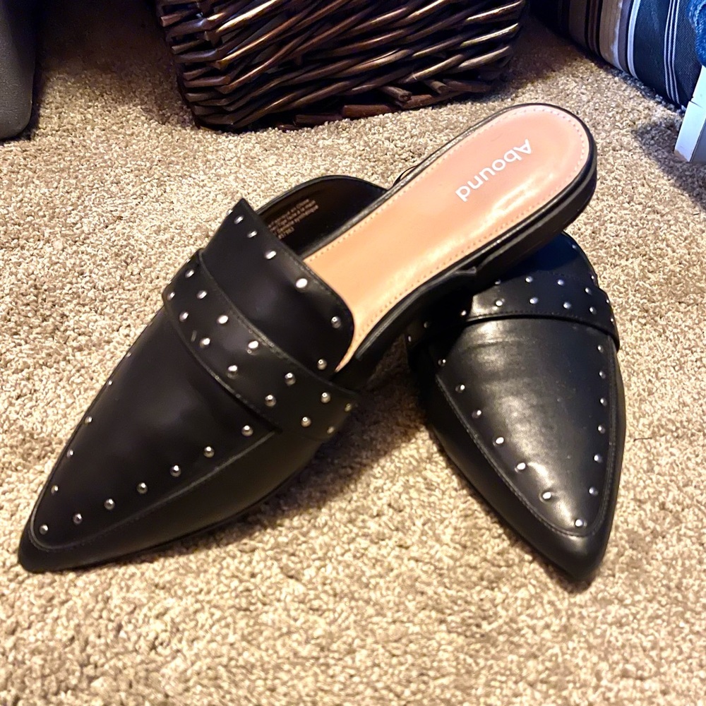 Brand new. Black mules size 9